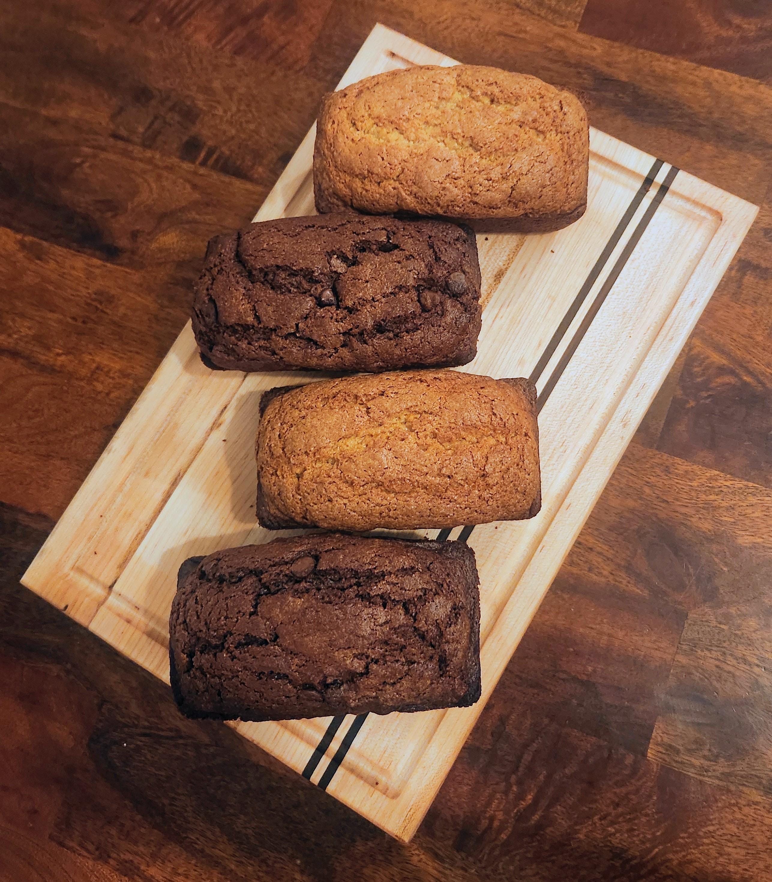 Handmade Maple cutting board with a walnut stripes.