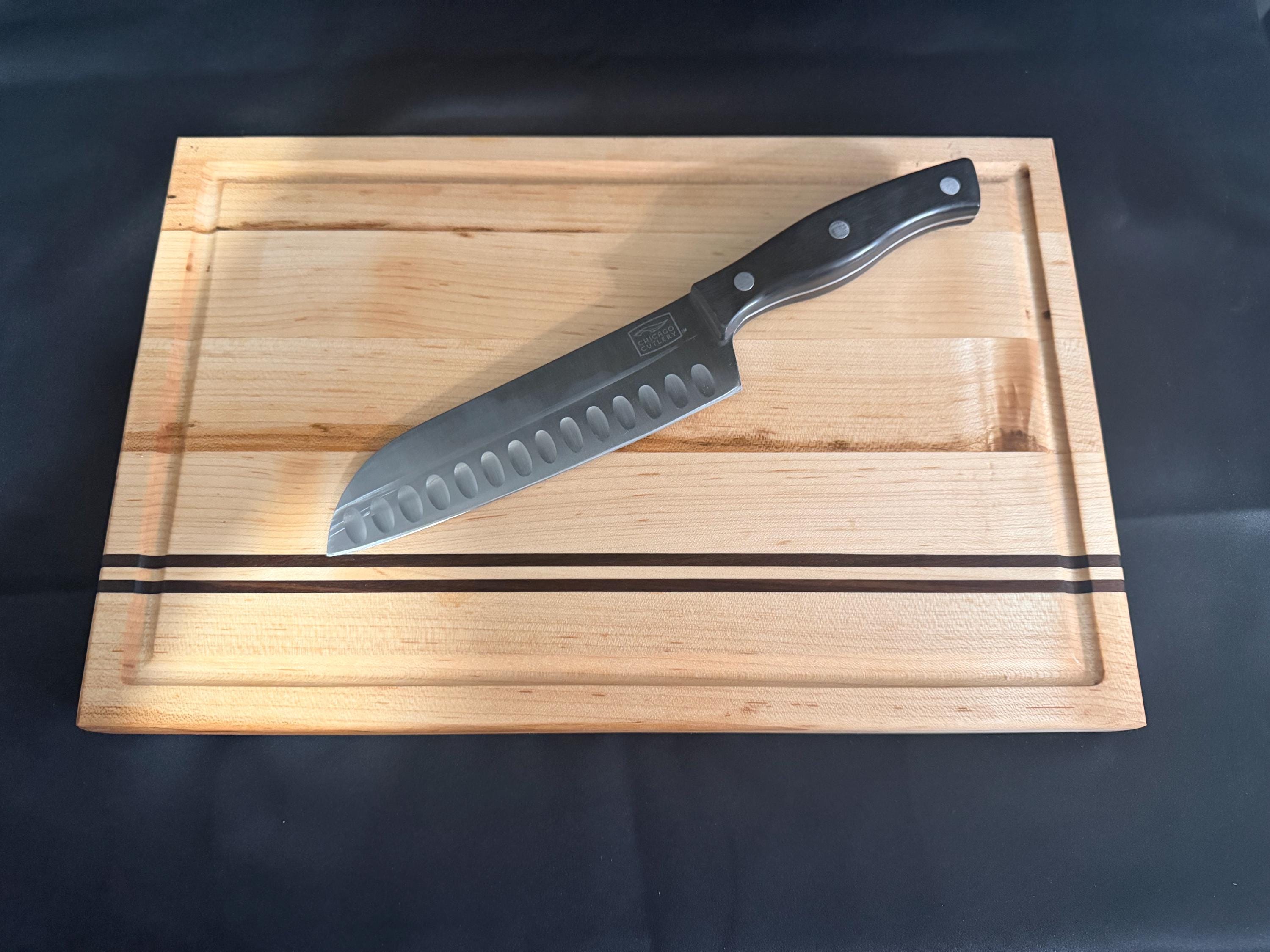 Handmade Maple cutting board with a walnut stripes.